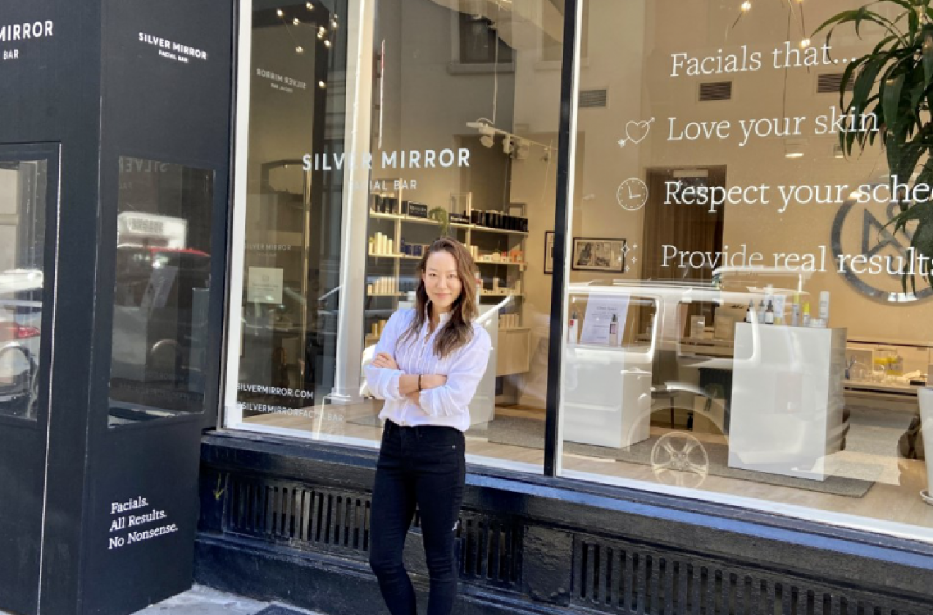 Cindy Kim stands in front of the Silver Mirror storefront